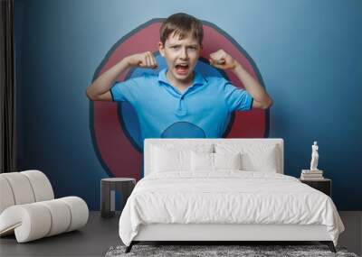 Boy superhero teenager raised his arms shouting strength power b Wall mural