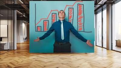 man businessman arms outstretched to the sides looking up graph  Wall mural