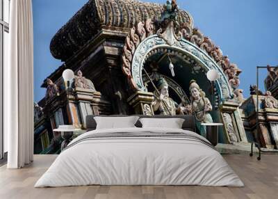 Hindu temple in Tamil Nadu, South India.  Sculptures on Hindu temple gopura (tower), sculpture of an Indian deity Wall mural