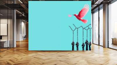 A diverse group of women hold up broken chains, symbolizing their liberation from societal constraints, a pink bird in flight symbol representing freedom soaring above them. Wall mural