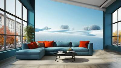 A serene landscape of a snow-covered field under a clear blue sky, highlighting the pure and untouched nature of the scene. Wall mural