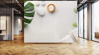 A stylish gray spa setting with a minimalist aesthetic, designed to promote relaxation and tranquility. The clean space provides ample copy space for adding text or graphics. Wall mural