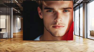 A young man with a determined look in his eyes, clutching a flag representing his ideals, symbolizing his commitment to honor and integrity. Wall mural