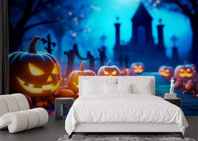 Background for Halloween party. Carved glowing pumpkins and dark blue blurred background with cemetery Wall mural