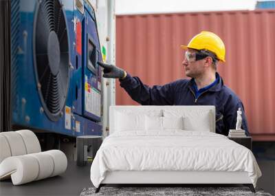 Engineer checking and setting temperature cooling units in freight of cargo logistic transport. Wall mural