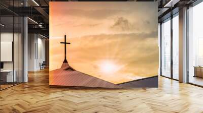 Holy Jesus cross on chapel roof with spiritual twilight sky and light leak background Wall mural