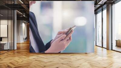 Successful businesswoman using smartphone mobile phone, banner with space for text. Wall mural