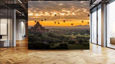 Sunrise above old pagodas misty with amazing clouds early morning and air balloons at Bagan, Myanmar. Wall mural