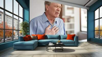 Caucasian elder man with chest pain. Heart attack patient. Wall mural