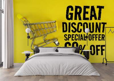 Great Discount 60% Special Offer text with trolley shopping cart on yellow background Wall mural