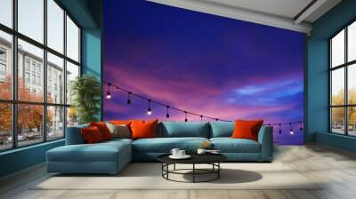 light bulb decor on string sunset sky on the beach Wall mural