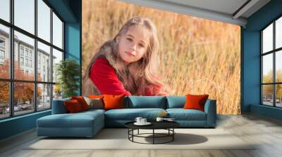 beautiful girl sitting on grass Wall mural