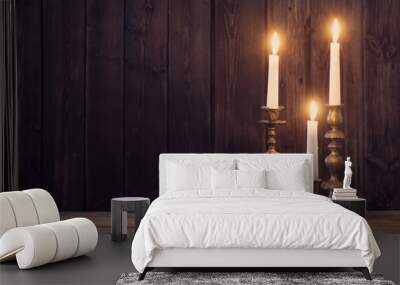 burning candle on old wooden background Wall mural