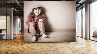 child sitting on the floor in room Wall mural