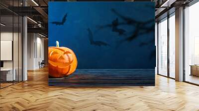 Halloween pumpkin on dark blue  background Wall mural