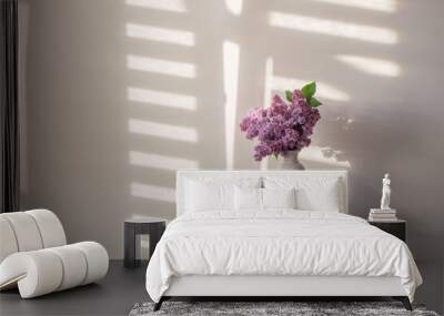 lilac flowers in white vase on background white wall Wall mural