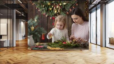 mother and daughter make  Christmas wreath Wall mural