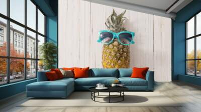 Ripe pineapple on a wooden background Wall mural