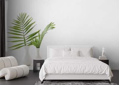 white vase with palm leaves on white background Wall mural