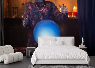 woman fortune teller with illuminated crystal ball Wall mural