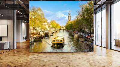 Cruise boat navigating Amsterdam canals Wall mural