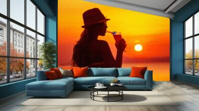 Closeup portrait of woman in hat with cocktail at tropical sunset Wall mural