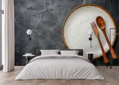 Top view of An empty plate with cutlery on a dark concrete background Wall mural