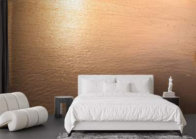 Water and sand at the beach in sunset time Wall mural