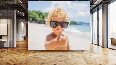  boy are playing on the beach Wall mural