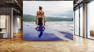 Beautiful woman by the pool Wall mural