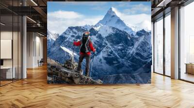 Hiker posing at camera on the trek in Himalayas, Nepal Wall mural