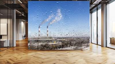 view from the window to the factory, pipes emitting harmful substances into the atmosphere. defocuse Wall mural