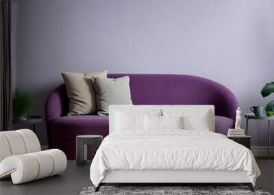 modern living room with sofa, Elegant living room Curved purple sofa decorated with two light beige pillows. Wall mural