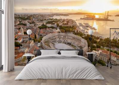 Aerial view of the historic Roman Amphitheatre of Pula at sunset, Croatia Wall mural