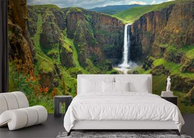 Maletsunyane Falls in Lesotho Africa. Most beautiful waterfall in the world. Green scenic landscape of amazing water fall dropping into a river inside canyons. Panoramic views over the great falls. Wall mural