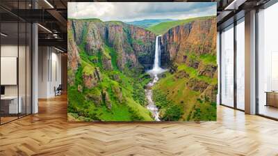 Maletsunyane Falls in Lesotho Africa. Most beautiful waterfall in the world. Green scenic landscape of amazing water fall dropping into a river inside canyons. Panoramic views over the great falls. Wall mural