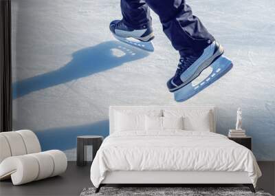 Close-up of ice skater's feet on ice rink Wall mural