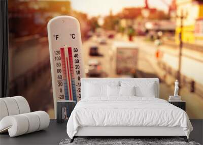 Thermometer in front of cars and traffic during heatwave in Montreal. Wall mural