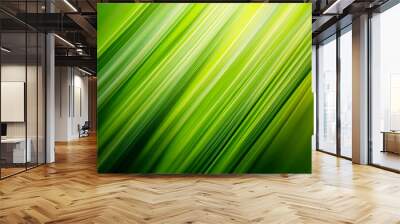 A close-up of vibrant green grass blades swaying in the breeze, creating an abstract background with dynamic lines and shapes. The sunlight highlights the texture and details on each blade. Wall mural