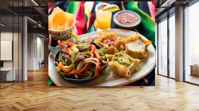 Fajita with beef steak, sautéed bell peppers, onions, tomatoes, in a cast iron skillet. Served with pico de gallo, refried beans, and guacamole in tortilla shells. Wall mural