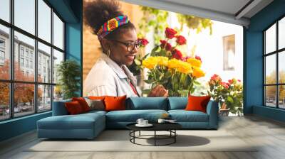 Afro American Teenage Girls Smelling Yellow Rose Flowers. Wall mural