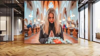 Young Woman Praying in Church Eyes Closed. Caucasian Woman Praying in a Church. Religious Concept.. Wall mural