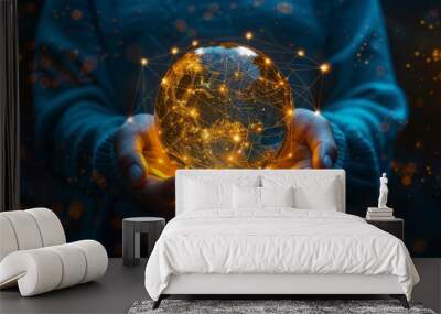 A person holding a digital earth globe with glowing connections, symbolizing global connectivity and technology in business. Wall mural