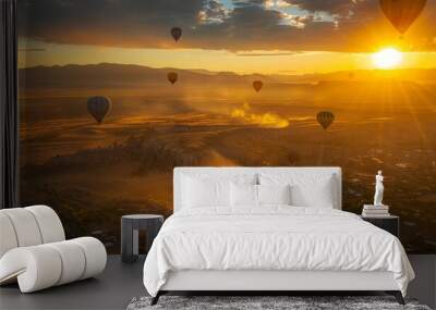 Aerial view of the hot air balloons rising majestically at sunrise, creating an enchanting scene, view from above with hundreds of hot air balloons floating in the summer sunset sky Wall mural