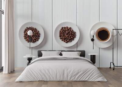 Coffee beans arranged in on plates or dishes, with one cup and saucer Copy space background on white table Wall mural