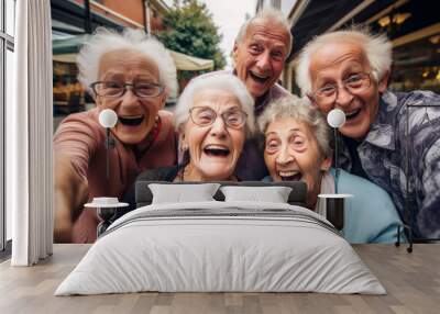 Group of elderly people taking a selfie, Spirited portrait, happy smiling group of senior citizens, pensioners having fun Wall mural