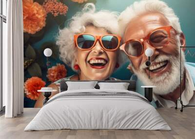 Happy group of senior friends smiling and laughing at camera outdoors - Older friends taking selfie pictures with smart mobile phone device - Life style concept with pensioners having fun together. Wall mural