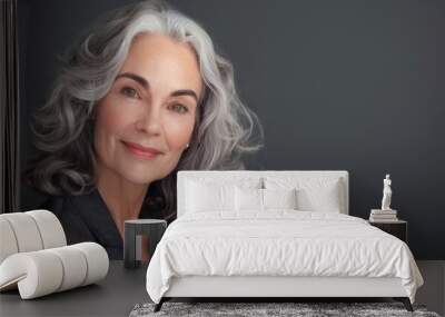 Older woman with silver grey hair, Mature senior model woman smiling for spa beauty and skincare in studio quiet confidence against a isolated backdrop. Copy space Wall mural