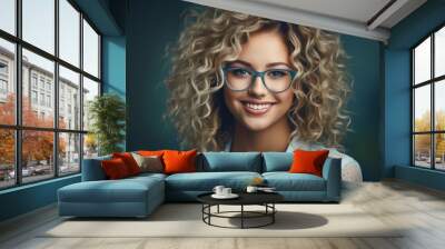 Young bright happy smiling blonde woman with curly hair and blue glasses smiling. portrait, a wonderful blonde young woman with glasses. optics, vision correction and eye imperfections. Optician. Wall mural