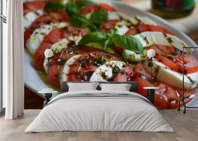 Caprese salad with mozzarella, tomatoes and basil on white plate Wall mural